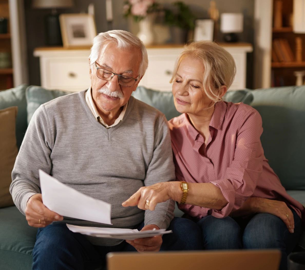 Elderly couple reviewing documents together