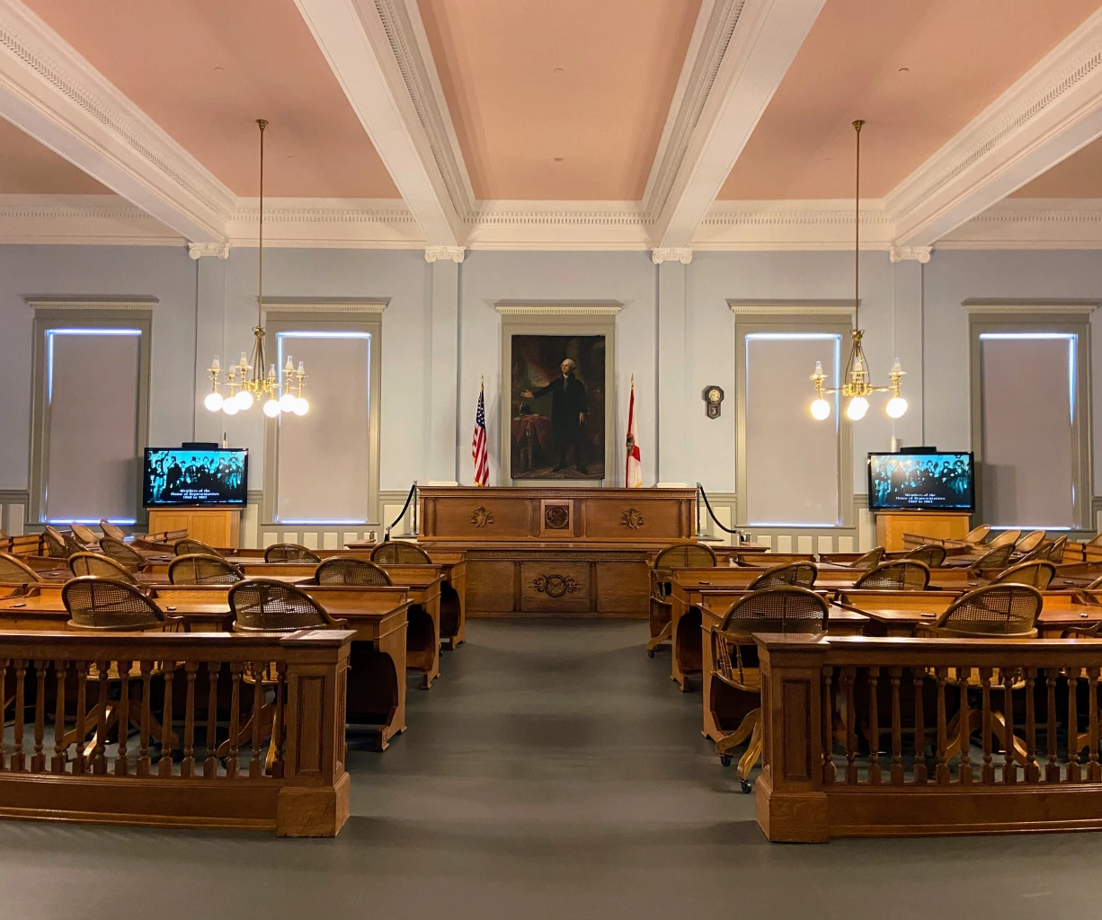 Traditional courtroom interior with portrait and flags
