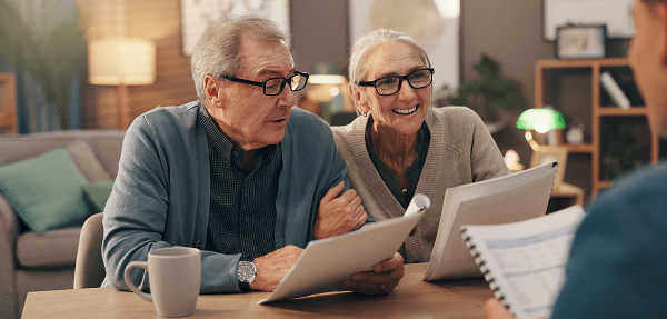 Senior couple reviewing documents together
